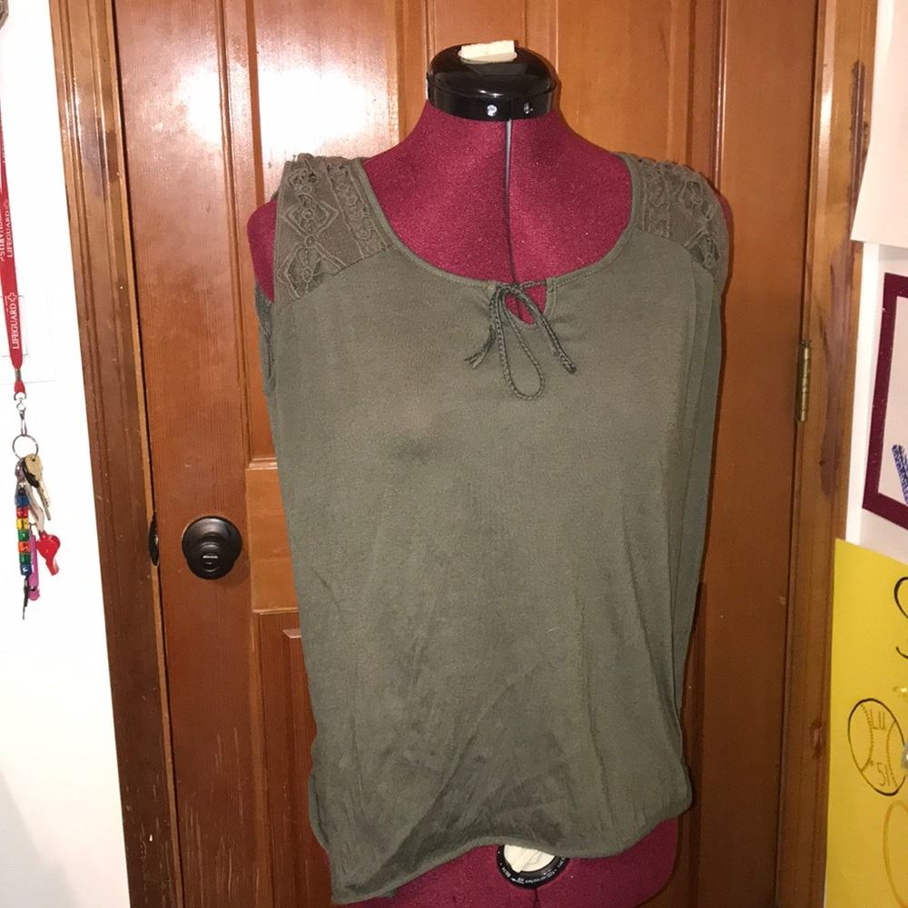 A dark green flowing sleeveless shirt